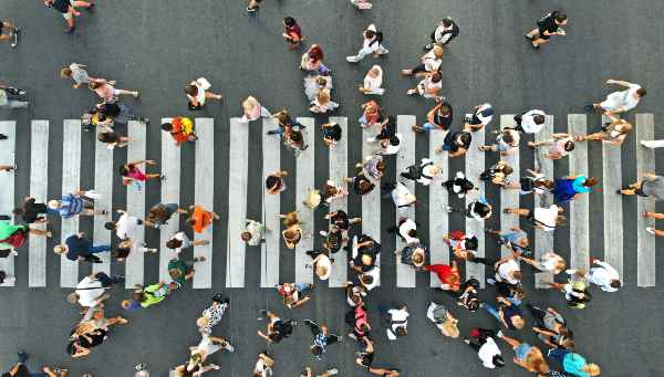 people in a crosswalk in houston 